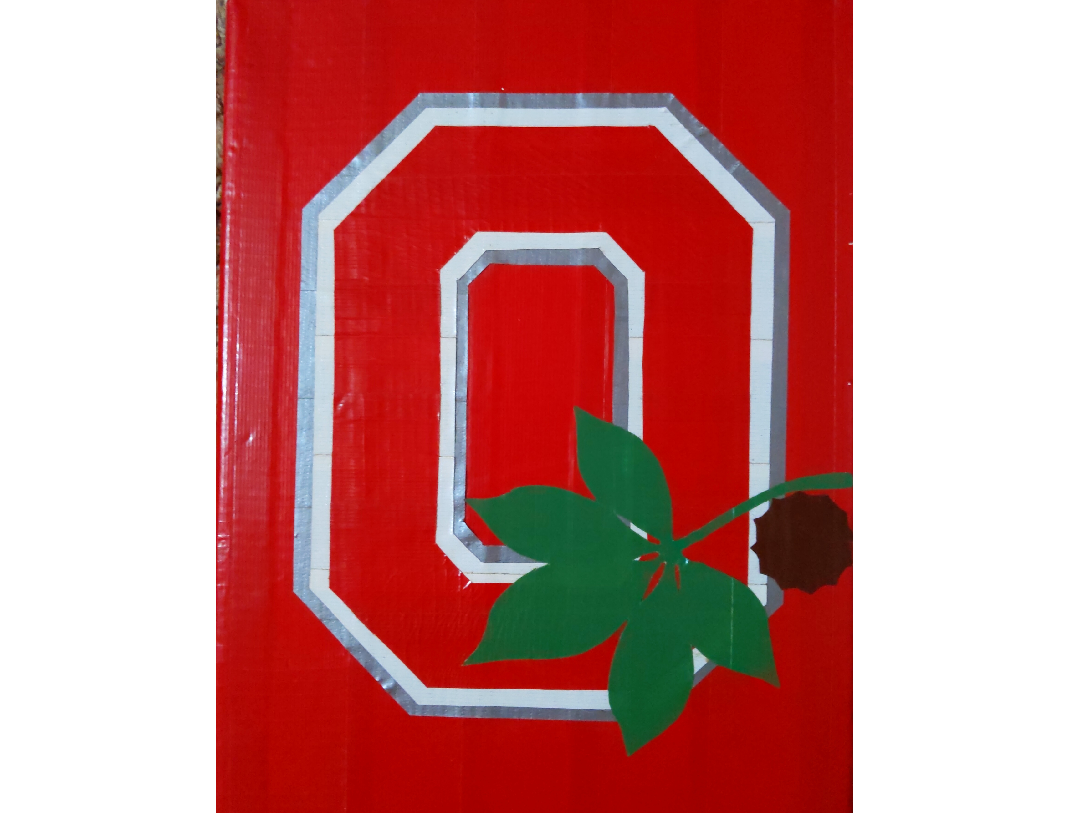 A duct tape art piece with a Block O.